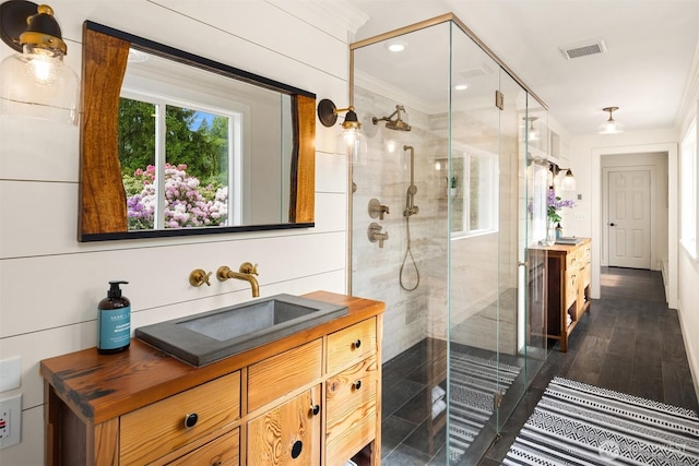 12653 Avondale Rd NE, Redmond, WA 98052 - bathroom featuring vanity, a stall shower, ornamental molding, and recessed lighting