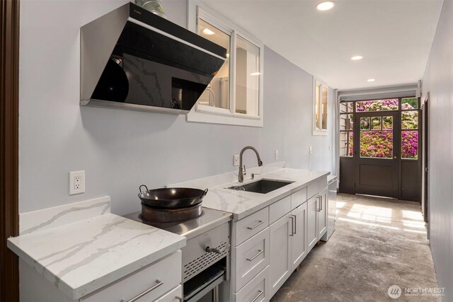 12653 Avondale Rd NE, Redmond, WA 98052 - kitchen with a sink, white cabinetry, recessed lighting, concrete floors, and light stone counters