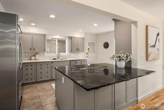 12653 Avondale Rd NE, Redmond, WA 98052 - kitchen featuring appliances with stainless steel finishes, gray cabinetry, a sink, backsplash, and recessed lighting