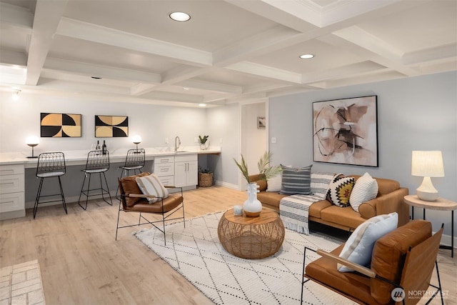 12653 Avondale Rd NE, Redmond, WA 98052 - living room featuring coffered ceiling, bar with sink, beamed ceiling, light wood finished floors, and baseboards