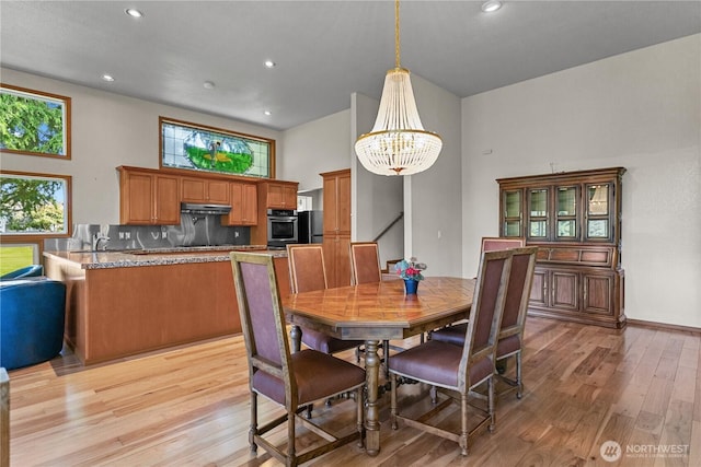 3726 SW 313th St, Federal Way, WA 98023 - dining space featuring light wood finished floors, healthy amount of natural light, a chandelier, recessed lighting, and baseboards