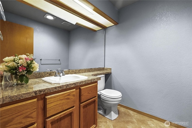 3726 SW 313th St, Federal Way, WA 98023 - bathroom with vanity, toilet, baseboards, tile patterned floors, and a textured wall