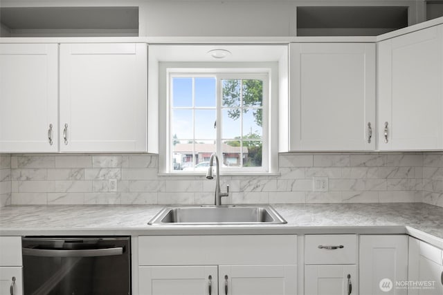 1221 Tillamook St, Walla Walla, WA 99362 - kitchen featuring stainless steel dishwasher, a sink, decorative backsplash, and light countertops