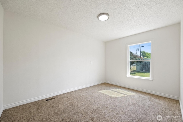 1221 Tillamook St, Walla Walla, WA 99362 - spare room featuring carpet floors, a textured ceiling, and baseboards