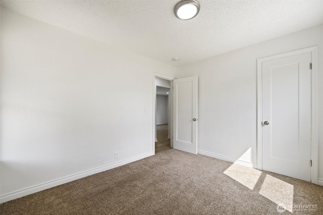 1221 Tillamook St, Walla Walla, WA 99362 - unfurnished bedroom with carpet floors, a textured ceiling, and baseboards