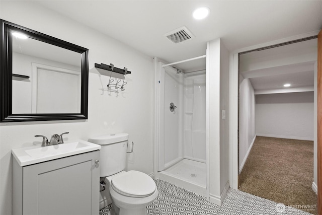 1221 Tillamook St, Walla Walla, WA 99362 - bathroom with a shower stall, toilet, vanity, recessed lighting, and baseboards