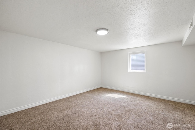 1221 Tillamook St, Walla Walla, WA 99362 - empty room with carpet, baseboards, and a textured ceiling