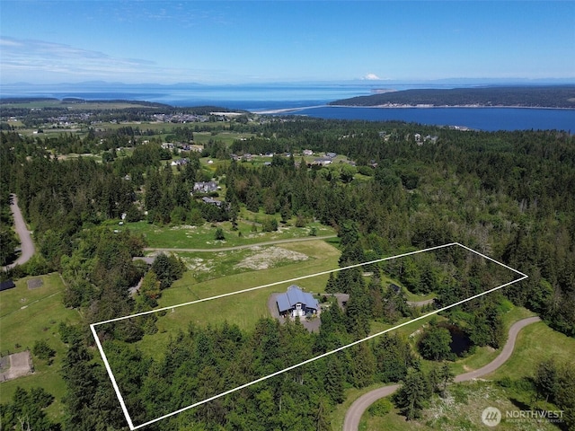 1068 Happy Valley Rd, Sequim, WA 98382 - aerial view of property and surrounding area with a large body of water, a heavily wooded area, and property parcel outlined