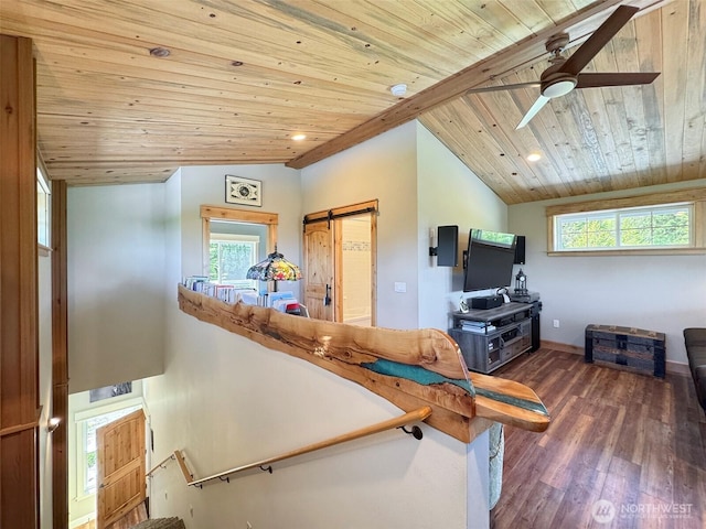 1068 Happy Valley Rd, Sequim, WA 98382 - living room with wood ceiling, wood finished floors, a barn door, ceiling fan, and lofted ceiling