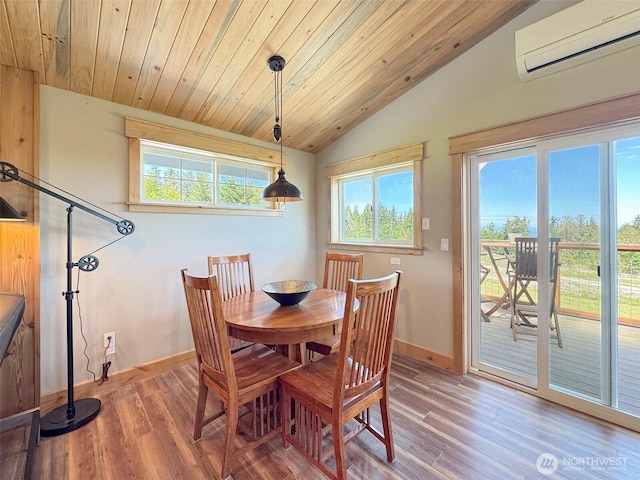 1068 Happy Valley Rd, Sequim, WA 98382 - dining area featuring a wall unit AC, vaulted ceiling, baseboards, wood finished floors, and wooden ceiling