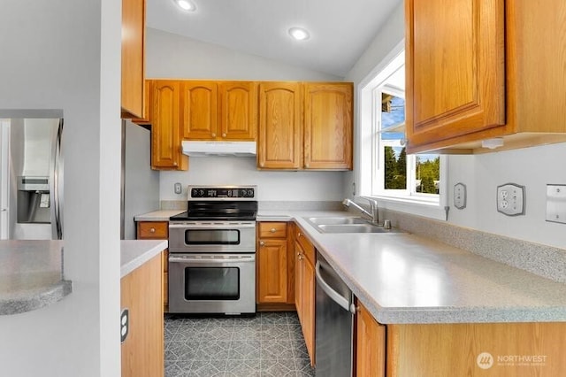 10903 Paine Field Way, Everett, WA 98204 - kitchen with stainless steel appliances, under cabinet range hood, a sink, light countertops, and lofted ceiling