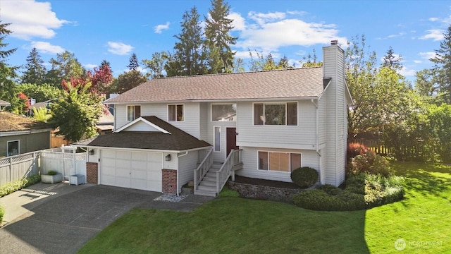 9 199th Pl SE, Bothell, WA 98012 - split foyer home with a chimney, driveway, roof with shingles, and a garage