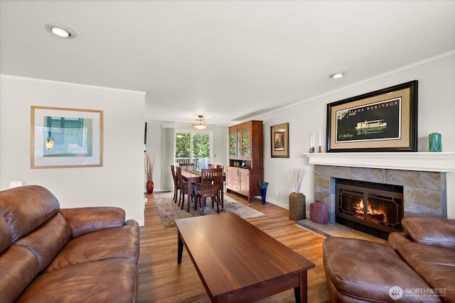 9 199th Pl SE, Bothell, WA 98012 - living room featuring crown molding, wood finished floors, baseboards, and a fireplace