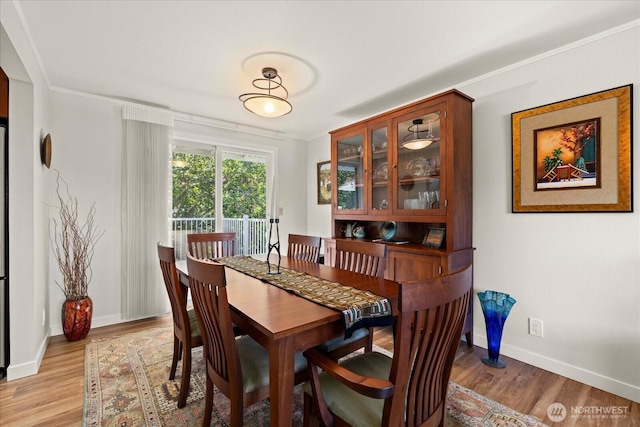 9 199th Pl SE, Bothell, WA 98012 - dining room with ornamental molding, light wood-style floors, and baseboards