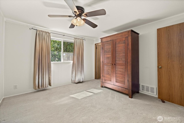 9 199th Pl SE, Bothell, WA 98012 - unfurnished bedroom featuring carpet, ornamental molding, a ceiling fan, and a closet