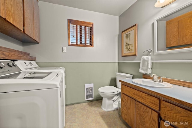 9 199th Pl SE, Bothell, WA 98012 - half bathroom with washer and clothes dryer, toilet, and vanity