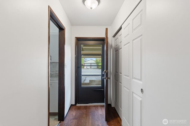310 S 11th St Unit 106, Mount Vernon, WA 98274 - doorway featuring dark wood-type flooring and baseboards