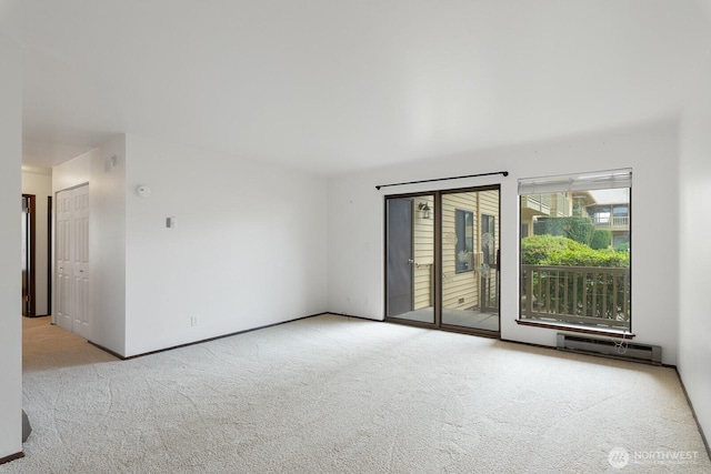 310 S 11th St Unit 106, Mount Vernon, WA 98274 - unfurnished room with carpet flooring and a baseboard heating unit