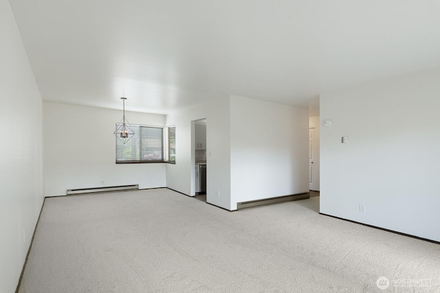 310 S 11th St Unit 106, Mount Vernon, WA 98274 - carpeted empty room with a baseboard radiator and a chandelier