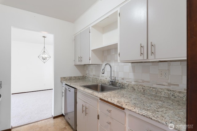 310 S 11th St Unit 106, Mount Vernon, WA 98274 - kitchen with tasteful backsplash, dishwasher, light carpet, pendant lighting, and light stone countertops