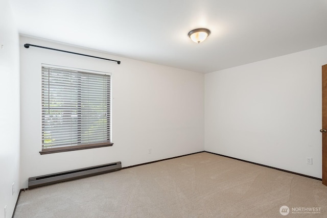 310 S 11th St Unit 106, Mount Vernon, WA 98274 - carpeted spare room with a baseboard heating unit and baseboards
