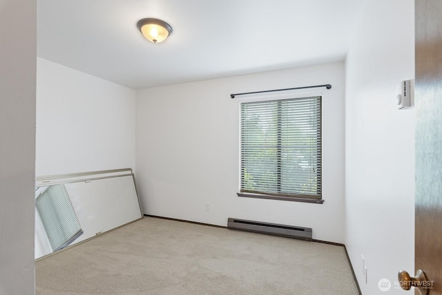 310 S 11th St Unit 106, Mount Vernon, WA 98274 - unfurnished room with carpet flooring and a baseboard heating unit