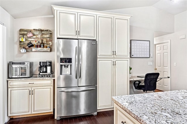 7606 Illahee Rd NE, Bremerton, WA 98311 - kitchen with stainless steel refrigerator with ice dispenser, light stone counters, lofted ceiling, and dark wood-type flooring