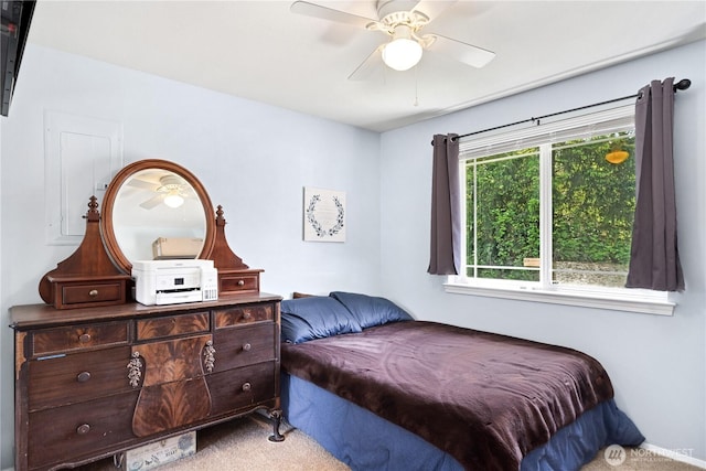 7606 Illahee Rd NE, Bremerton, WA 98311 - bedroom with light colored carpet and a ceiling fan