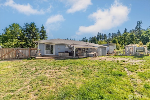 7606 Illahee Rd NE, Bremerton, WA 98311 - back of property featuring a gate, a deck, and an outdoor structure