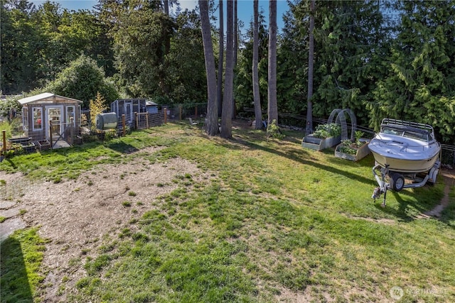 7606 Illahee Rd NE, Bremerton, WA 98311 - view of yard featuring a garden, exterior structure, and an outdoor structure