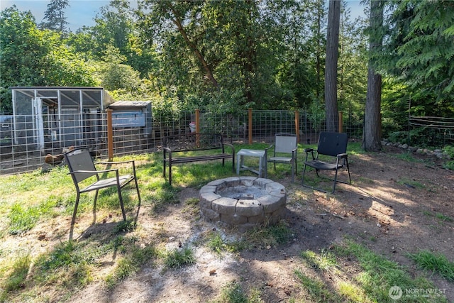 7606 Illahee Rd NE, Bremerton, WA 98311 - view of yard featuring an outdoor fire pit, an outbuilding, and exterior structure