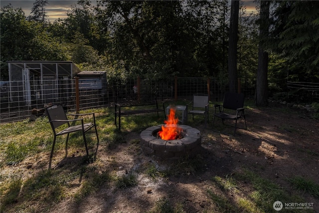 7606 Illahee Rd NE, Bremerton, WA 98311 - yard at dusk featuring an outdoor fire pit