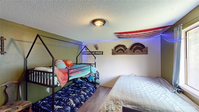 6 Elgin Way, Oroville, WA 98844 - bedroom with wood finished floors and a textured ceiling