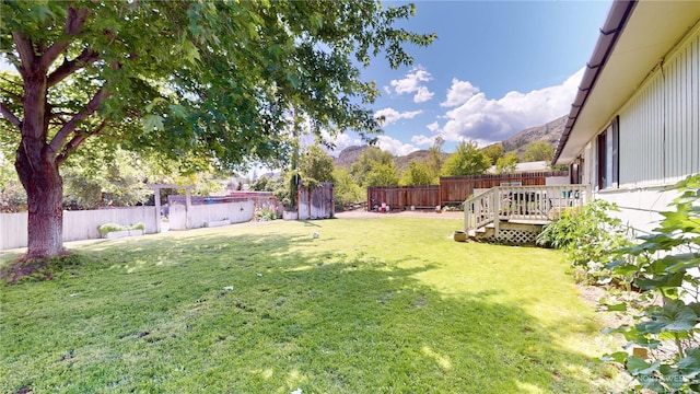 6 Elgin Way, Oroville, WA 98844 - view of yard with a deck with mountain view