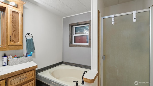 311 W Clay, Dayton, WA 99328 - full bathroom with vanity, a stall shower, and a garden tub