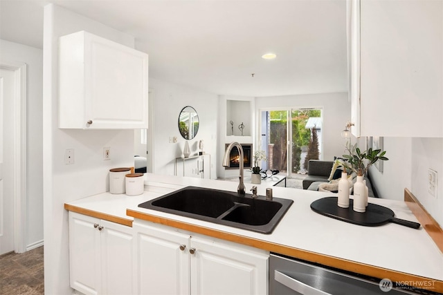18621 Blueberry Ln Unit A104, Monroe, WA 98272 - kitchen featuring stainless steel dishwasher, white cabinets, open floor plan, light countertops, and recessed lighting