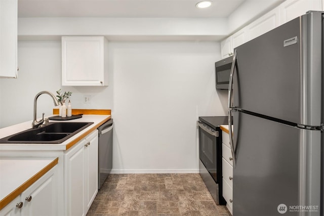 18621 Blueberry Ln Unit A104, Monroe, WA 98272 - kitchen with stainless steel appliances, white cabinetry, light countertops, recessed lighting, and stone finish flooring