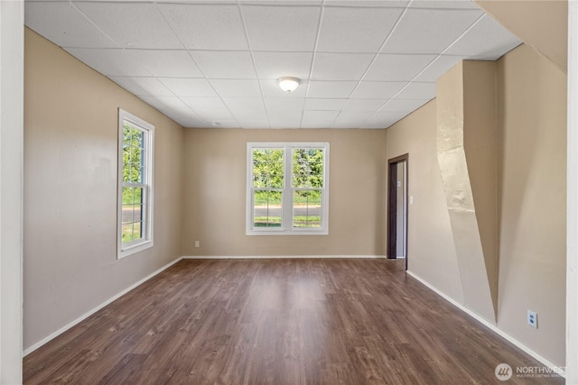1109 River St, Hoquiam, WA 98550 - empty room featuring a paneled ceiling, wood finished floors, and baseboards