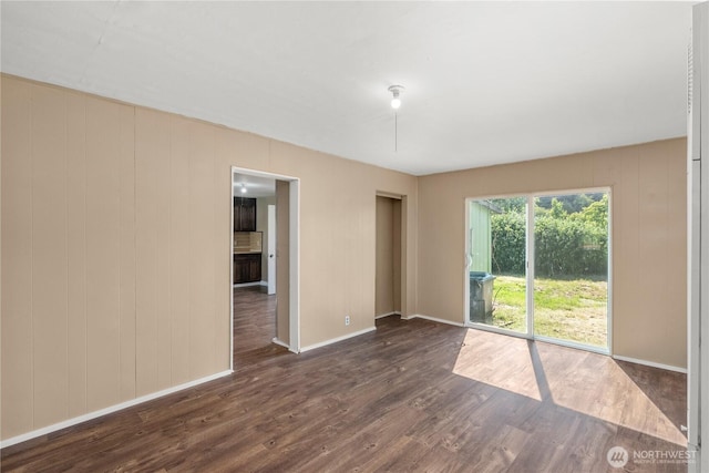 1109 River St, Hoquiam, WA 98550 - empty room with dark wood-type flooring and baseboards