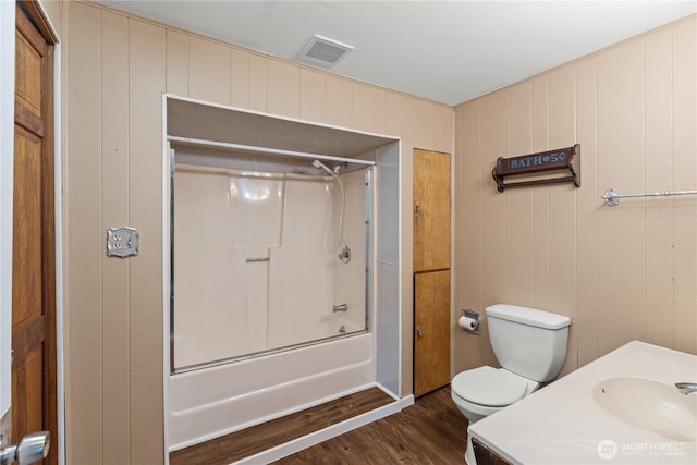 1109 River St, Hoquiam, WA 98550 - bathroom with wood finished floors, bathing tub / shower combination, toilet, and vanity