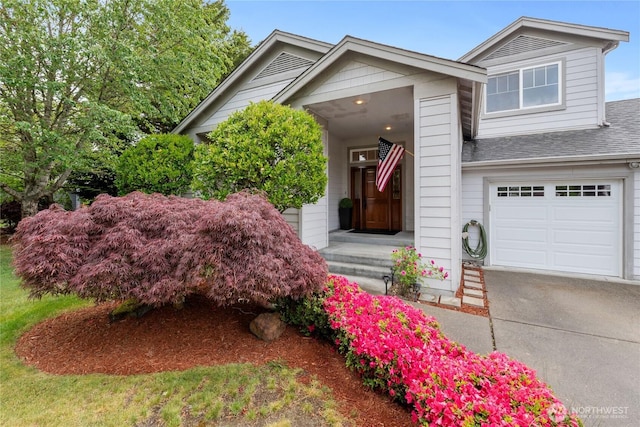 2433 18th St SE, Puyallup, WA 98374 - view of front of house featuring a garage, driveway, and roof with shingles