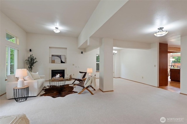 2433 18th St SE, Puyallup, WA 98374 - living room featuring carpet, a fireplace, plenty of natural light, and baseboards