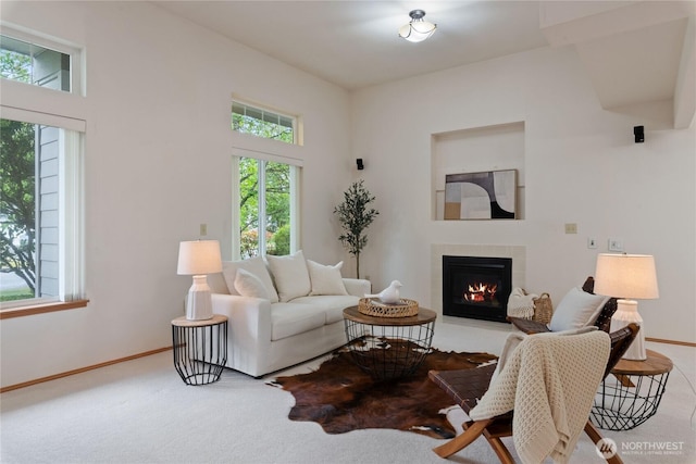 2433 18th St SE, Puyallup, WA 98374 - carpeted living room featuring a tiled fireplace and baseboards