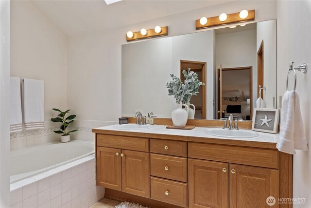 2433 18th St SE, Puyallup, WA 98374 - ensuite bathroom featuring double vanity and a bath