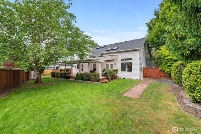 2433 18th St SE, Puyallup, WA 98374 - rear view of property featuring crawl space, a wooden deck, and a shingled roof