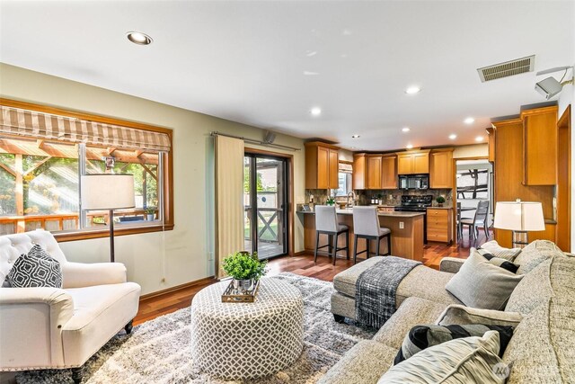 16515 126th Ave NE, Woodinville, WA 98072 - living area with wood finished floors, recessed lighting, and baseboards