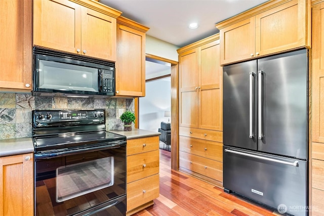 16515 126th Ave NE, Woodinville, WA 98072 - kitchen featuring black appliances, light wood-style floors, backsplash, light countertops, and recessed lighting