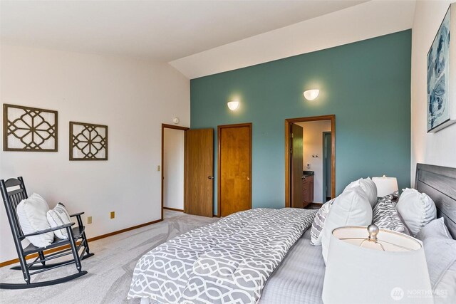 16515 126th Ave NE, Woodinville, WA 98072 - bedroom with light carpet, high vaulted ceiling, baseboards, and connected bathroom