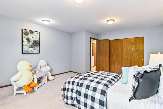 16515 126th Ave NE, Woodinville, WA 98072 - bedroom featuring carpet flooring, baseboards, and a closet