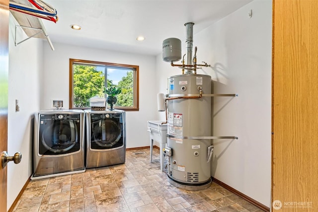 16515 126th Ave NE, Woodinville, WA 98072 - laundry area with water heater, washer and dryer, baseboards, stone finish floors, and recessed lighting